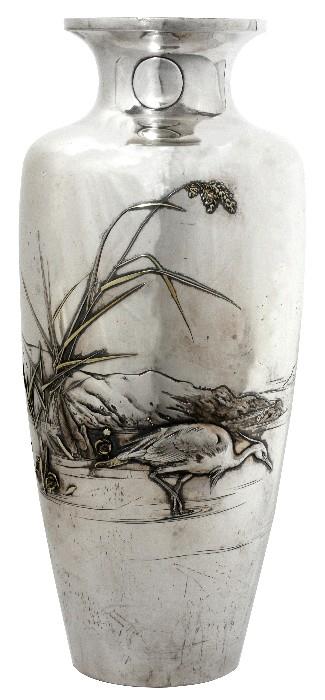 Lot#1001, KAGAWA KATSUHIRO (1853-1917), JAPANESE SILVER VASE, MEIJI PERIOD, H 14", DIA 6",Featuring a coastal seascape scene with bamboo and a feeding crane enhanced with gold and silver inlay.  Six-character mark on the underside (see additional photo).  Kagawa Katsuhiro, Japanese,1853-1917; Meiji period, 1868-1912.  Weighs approximately 70.3 troy oz.