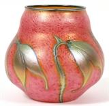 Lot#1195, CHARLES LOTTON, STUDIO GLASS VASE, 1994, H 7", DIA 7 1/2",Mottled pink and orange ground with an iridescent floral motif about, signed and dated "Charles Lotton 1994" about the base.