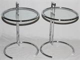 Lot#1229, EILEEN GRAY (1878-1976) CHROME & GLASS ADJUSTABLE SIDE TABLES, PAIR, H 21''-34'', DIA 20''Each having a circular glass top in tubular chromed metal frame, measuring H.21''-34'', Dia.20''.