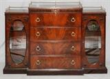Lot#1236, MAHOGANY FOUR-DRAWER CREDENZA, H 44", W 53", D 14"Having a brass gallery, four central drawers flanked by glass doors which each reveal two glass shelves.  Measures H.44 1/2" x 53" x 14 1/4".