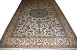 Lot#2078, NAIN ORIENTAL RUG, 12' 0" X 7' 10",Ivory ground with round central medallion, flowering vine overall, within multiple floral borders, in neutral tones.
