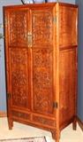Lot#2179, CHINESE HAND-CARVED WALNUT ARMOIRE, H 73", W 35", D 23"Two doors above double half width drawers, decorated with carved scroll designs in bas relief.