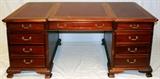 Lot#2180, CHIPPENDALE STYLE MAHOGANY EXECUTIVE DESK, H 30'', L 72''Having three inlaid tooled leather panels at top; featuring a center drawer flanked by four side drawers.  Measures H. 30 1/2" x 72" x 36".