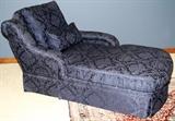 Lot#2194, UPHOLSTERED CHAISE LOUNGE, H 37" L 75"Two-cushioned, having navy blue upholstery with monochromatic floral decoration.