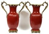 Lot#2295, FRENCH STYLE PORCELAIN VASES H 23.5", DIA 19", The vases are dark coral in color with a ribbed design and enhanced by bronze handles and bases.