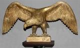Lot#176, FRANCIS A. LITTLEFIELD, CARVED WOOD AMERICAN EAGLE, 19TH C. AND PEDESTAL H 26" W 64"Outstretched wings; well defined with tendons on his claws, glass eyes.  Signed by the maker "FL"  Retains much original patina.