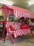 Coca Cola yard swing with Coke pillows
