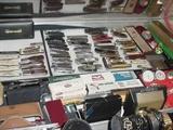 another view of the large pocket knife collection, plus a dozen pocket watches and many wrist watches, and other mens accessories