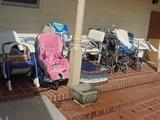 More of the chiold seats, chairs, plus several wheel chairs and handicap equipment