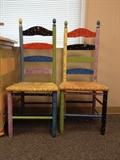 pair of whimsically painted chairs