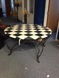 beautifully checkered mosaic tabletop on iron base by Sarreid  