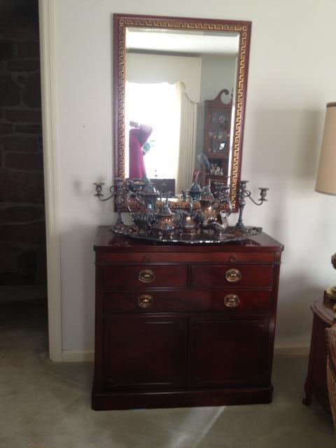 duncan phyfe server beveled mirror above and Towle silver service, candelabra