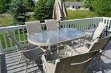 Deck table with six chairs, umbrella and stand