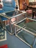 Tubular chrome & brass end tables. Mid Century Modern. In the style of John Mascheron
