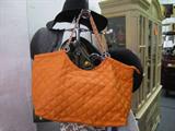 Variety of purses, backpacks, briefcases and computer cases.