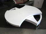 Low coffee table with a top that swivels