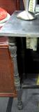 A corner detail of Long Industrial metal console.