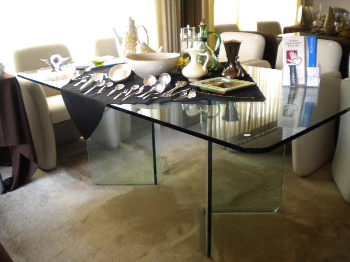 Glass dinning table with glass pedestal base