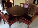 Game table with leather arm chairs
