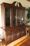 Broken arch, lighted china cabinet
