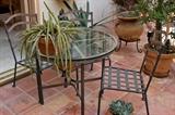 Iron and Glass Bistro Set |
Fabulous little bistro set with a thick cut 36 inch glass top blends classic forms with designer details.