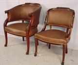 107 - Mahogany arm chair and side chair with carved lions heads on arm and claw feet, brown leather upholstery, arm chair, 35in. T, 24in. W, 21in. D.