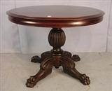 104 - Mahogany Empire round center table with acanthus carved feet, 30in. T, 40in. Dia. Ca. 1880.