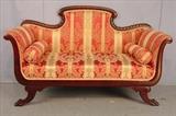 109 - Mahogany empire love seat with gold and red stripe upholstery on claw feet, 37in. T, 60in. W, 23in. D.