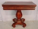 108 - Mahogany empire game table with pumpkin base and scroll feet, ca. 1850, 30in. T, 35in. W, 18in. D.