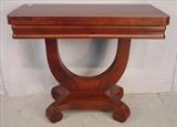 119 - Mahogany empire game table with yolk base and scroll feet, ca. 1840, 28in. T, 34in. W, 17in. D.