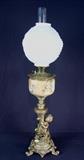 147 - Oil lamp that has been electrified with cherubs and white shade, 41in. T.