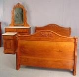 134 - Three piece oak bedroom suit with marble top dresser and wash stand, ca. 1900.