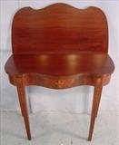 215 - Mahogany inlayed game table, regency style, 30in. T, 36in. W.