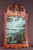 211 - Flame mahogany Chippendale mirror with great carvings, 51in. T, 28in. W.