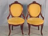 279 - Pair of walnut Victorian hip rest parlor side chairs, gold upholstery, ca. 1880.