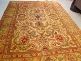 245 - Hand made wool Persian rug, gold and red, 7ft 9i . X 11ft 2in .