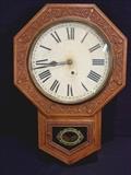 334 - Oak hanging wall clock, Ansonia Clock Co.