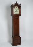Federal Period cherry grandfather or tall case clock having brass works with repainted dial. The bonnet having pierced fret work and five wood turned finials. The clock complete with key and pendulum and double weights. Maximum H: 90".