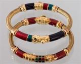Pr. of 18K y.g. ladies bracelets having enamel decoration retailed by The Metropolitan Museum of Art NYC. Total dwt. 32.2 (enamel & possibly other internal components included in weight.