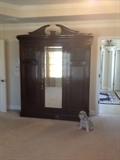 Stately Armoire..a true antique with lots of storage..just imagine the possibilities!