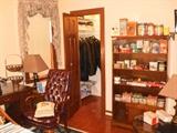 Fine desk and chair, closet full of leather jackets and hats