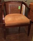 Vintage gold velour chair with cane back.