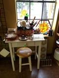 Cute little desk, stool, and stained glass.