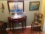 Antique demilune table, vintage art, Eastlake chair with rush seat.