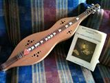 Appalachian dulcimer with music books and case