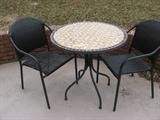 Outdoor round table with two chairs