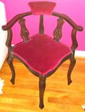 Single pink upholstered corner boudoir chair.