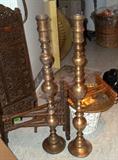Middle eastern pieces including two tall candlesticks.