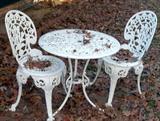 White cast iron table and chairs.