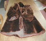 Tattered mouton coat. Not faux.